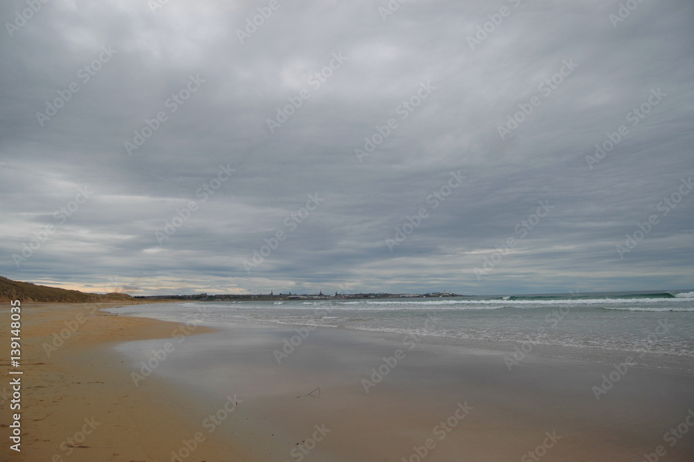 Dramatic soft grey clouds above a deserted beach in Fraserburgh, Scotland Dramatic soft grey clouds above a deserted beach in Fraserburgh, Scotland