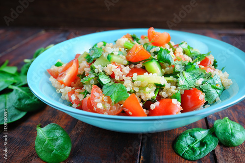 Tabbouleh salad on wooden table