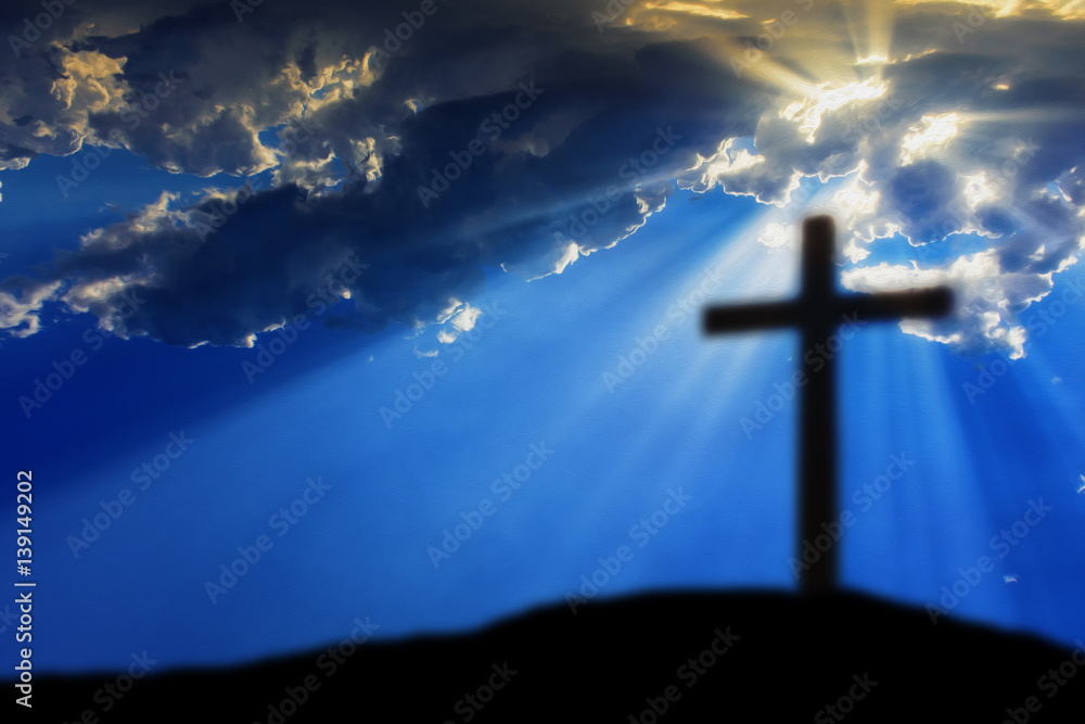 Obraz premium Cross on the Calvary hill with cloudy sky and sun light beams or rays. Abstract blury religious background.