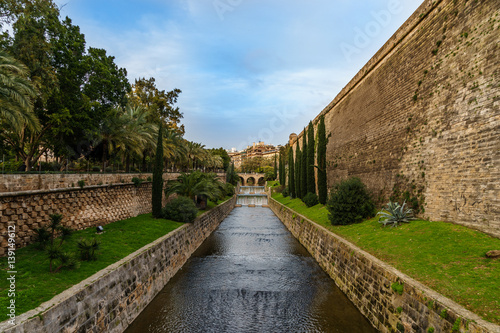 bridge on a canal in a mediterranean park