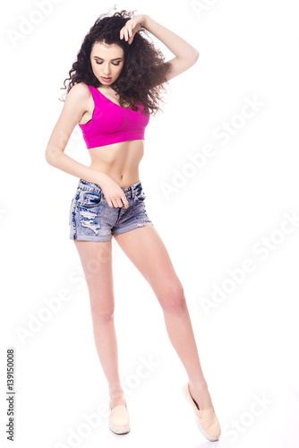 Portrait of happy young woman in jeans shorts and a topic