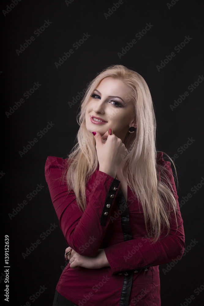 Smiling woman with lush blonde hair dressed in blouse Smiling woman with lush blonde hair dressed in blouse