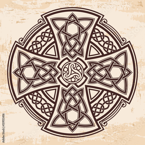 Celtic national ornament in the shape of a cross. Brown drawing with aging effect on a beige background.
