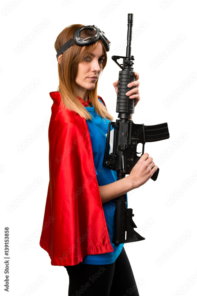 Pretty superhero girl holding a rifle