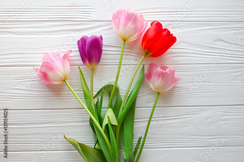 Fototapeta Naklejka Na Ścianę i Meble -  Wooden white background and pink tulips.  March 8, Mother's Day.