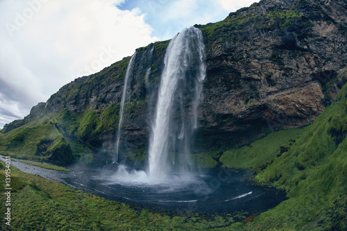 famous Skogarfoss waterfall in southern Iceland. treking in Iceland. Travel and landscape photography concept