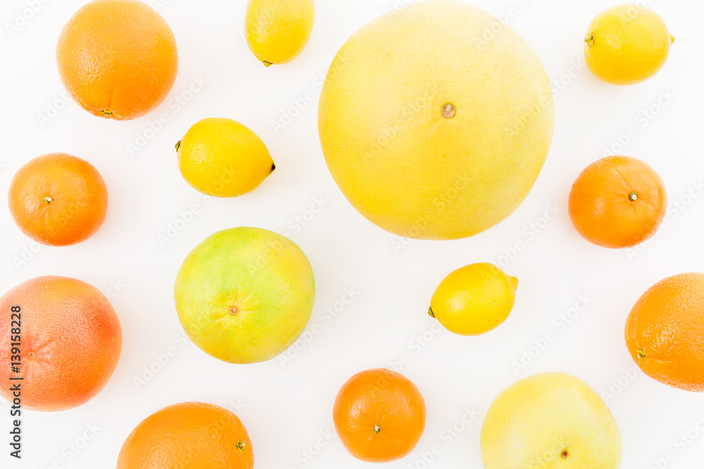 Fruit's background. Citrus fruits - lemon, orange, grapefruit, sweetie and pomelo isolated on white background. Flat lay, top view. Fruit's background. Citrus fruits - lemon, orange, grapefruit, sweetie and pomelo isolated on white background. Flat lay, top view.