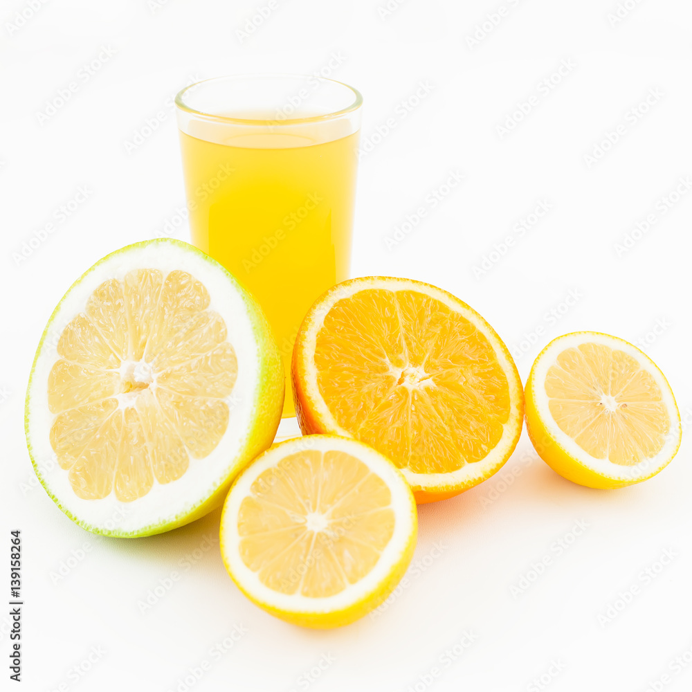 Citrus juice made of lemon, orange and sweetie on white background. Flat lay, top view. Fruit's background Citrus juice made of lemon, orange and sweetie on white background. Flat lay, top view. Fruit's background