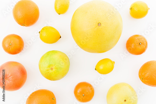 Fruit s background. Citrus fruits - lemon  orange  grapefruit  sweetie and pomelo isolated on white background. Flat lay  top view.