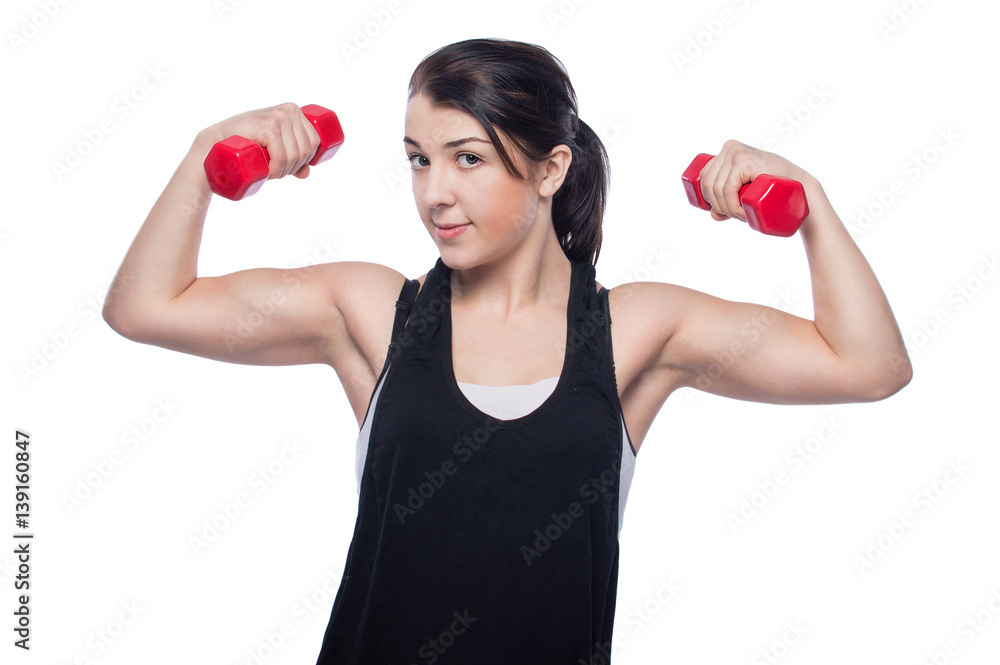 Girl athlete with dumbbells , practice. Girl athlete with dumbbells , practice.