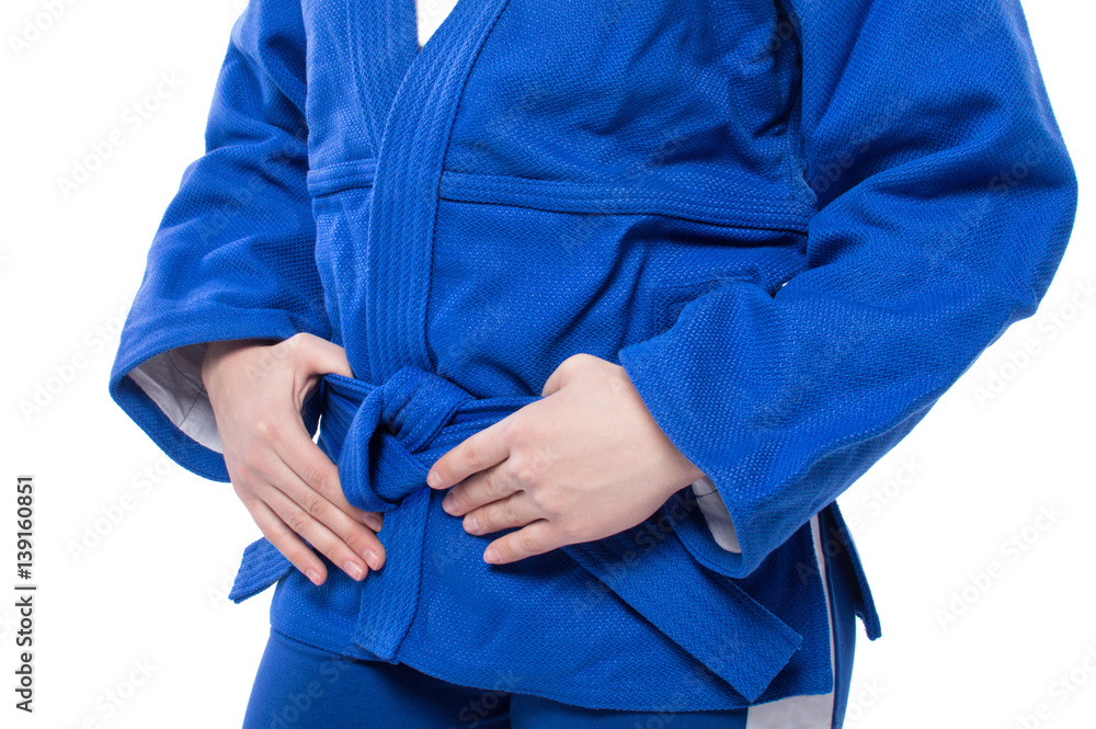 Sambo. Tying the belt. Blue form on the woman.