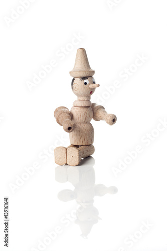 Wooden Pinocchio doll isolated on white background.