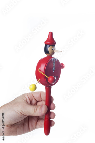 Wooden Pinocchio doll isolated on white background.