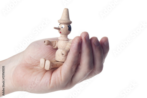 Wooden Pinocchio doll isolated on white background.
