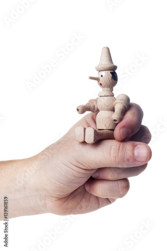 Wooden Pinocchio doll isolated on white background.