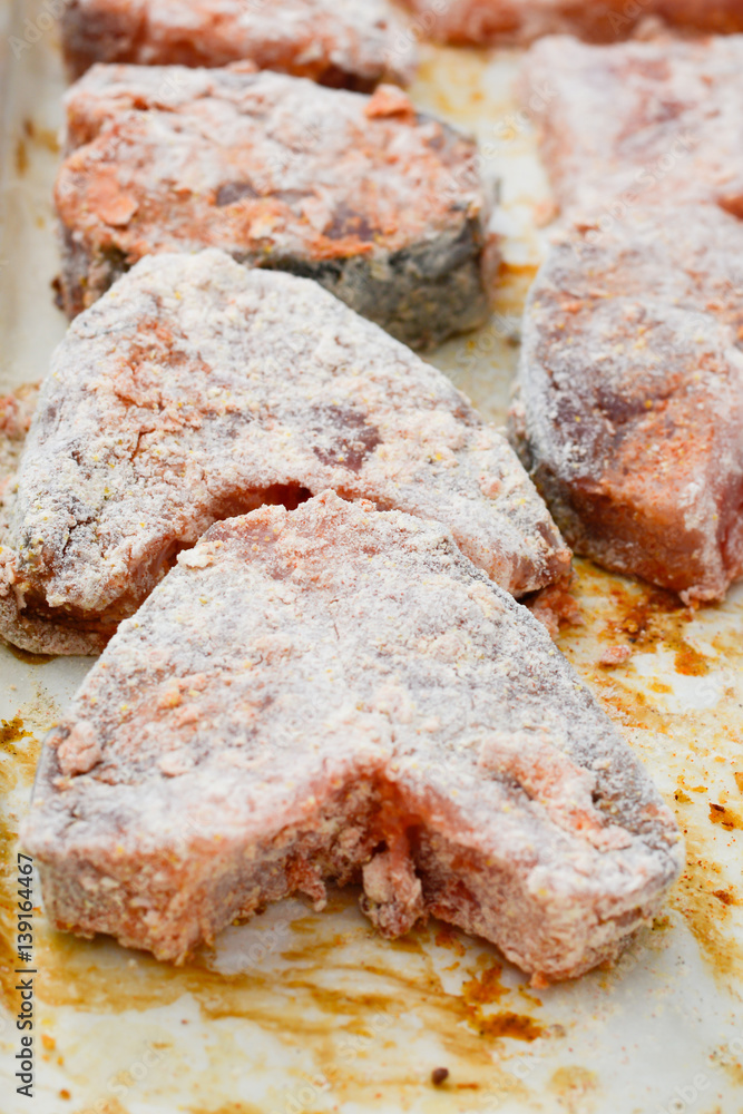 Fish steaks covered with wheat flour and bread crumbs Fish steaks covered with wheat flour and bread crumbs