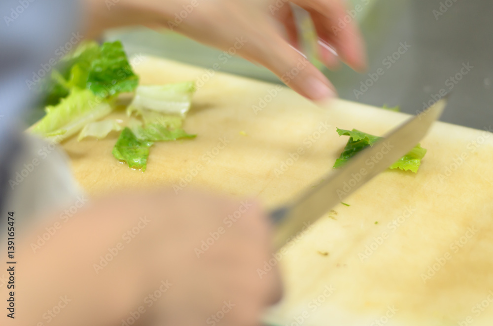 Chef cutting greencos prepare food in restaurant,Hand cutting vegetable fast it's skill