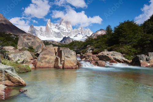 Wide angle long exposure landscape featuring Monte Fitz Roy in the background and clear water river in the foreground, Patagonia, Argentina photo