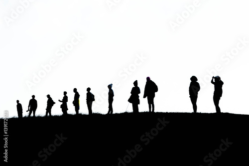 silhouette group of hiking on mountain with white background, subject is blurred