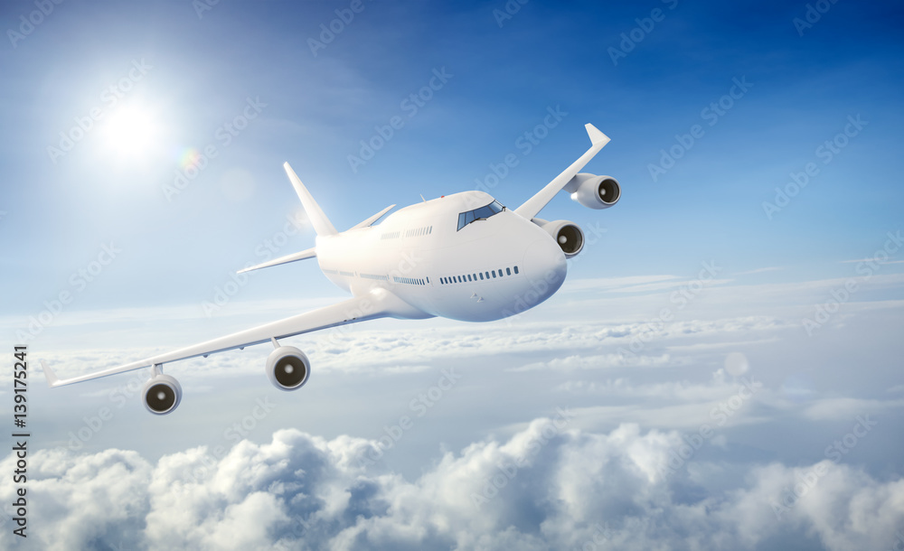 Fototapeta premium Airplane flying above clouds