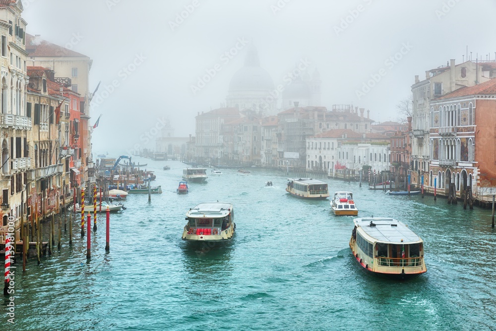 Fototapeta premium Gondola on Canal Grande with Basilica di Santa Maria della Salute in the background, Venice, Italy