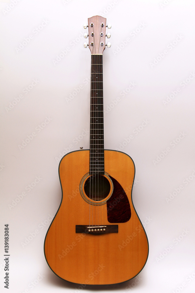 Acoustic guitar on a white background. Acoustic guitar on a white background.