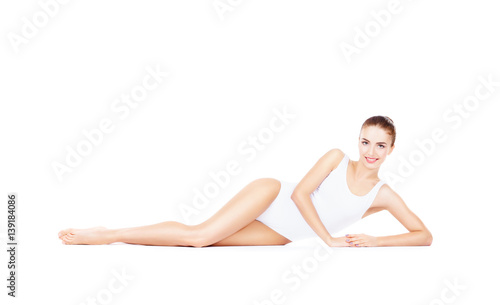 Fit and sporty girl in white underwear. Beautiful and healthy woman posing over isolated white background. Sport, fitness, diet, weight loss and healthcare concept.