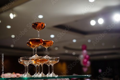 small tower of champagne's glass in wedding reception party