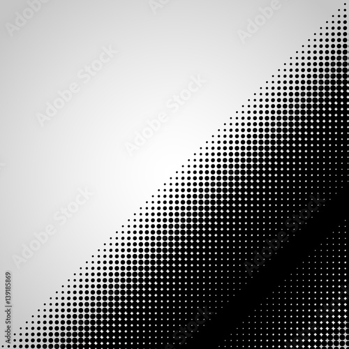 Halftone abstract black dots design element isolated on a white background.