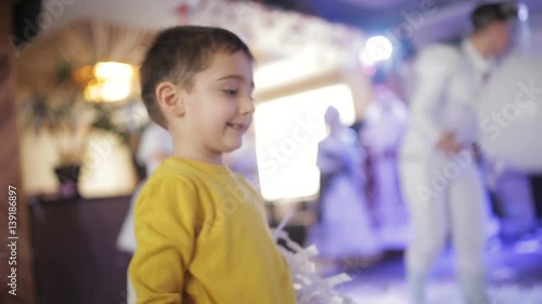 Wallpaper Mural Children's festival. a little boy playing with paper confetti. Torontodigital.ca