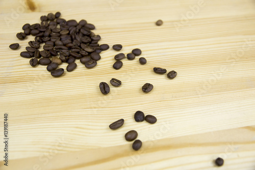 Scattered coffee beans on table
