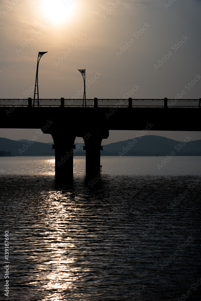 view of bridge in the river,in wuxi city,jiangsu province,China. view of bridge in the river,in wuxi city,jiangsu province,China.