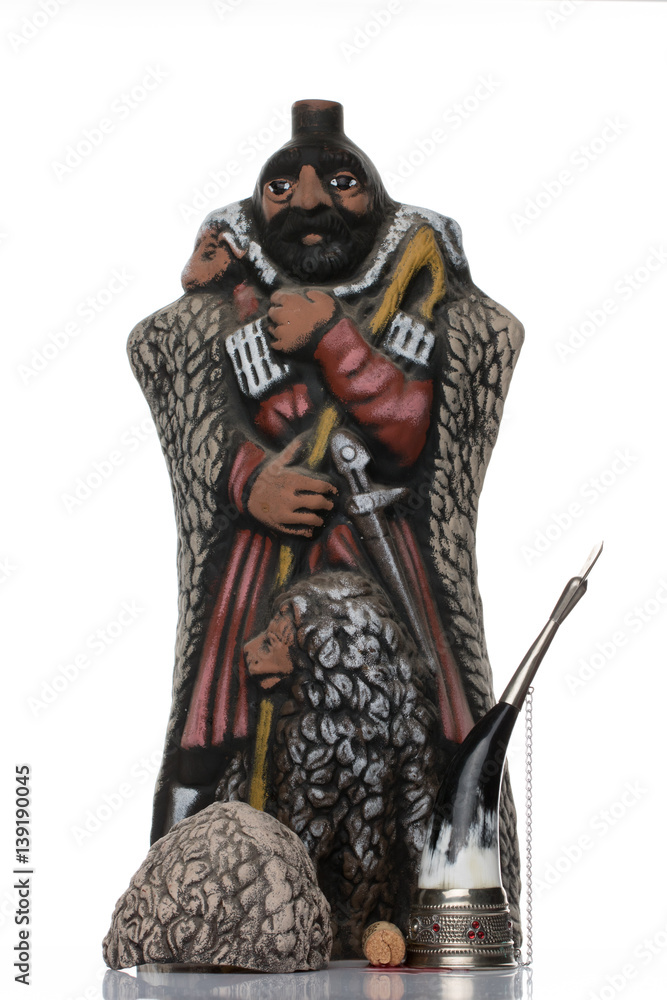 Obraz premium bottle of wine in a Georgian shepherd and a horn of wine