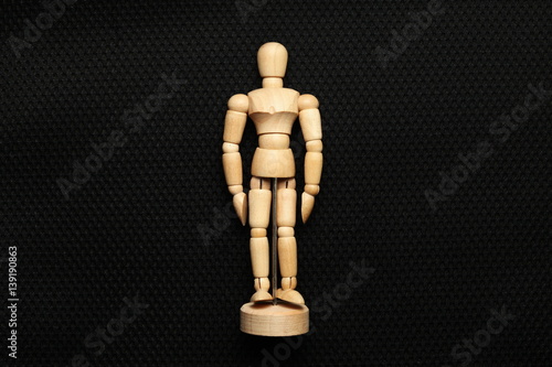 A wooden art doll represent the art and action concept related idea.