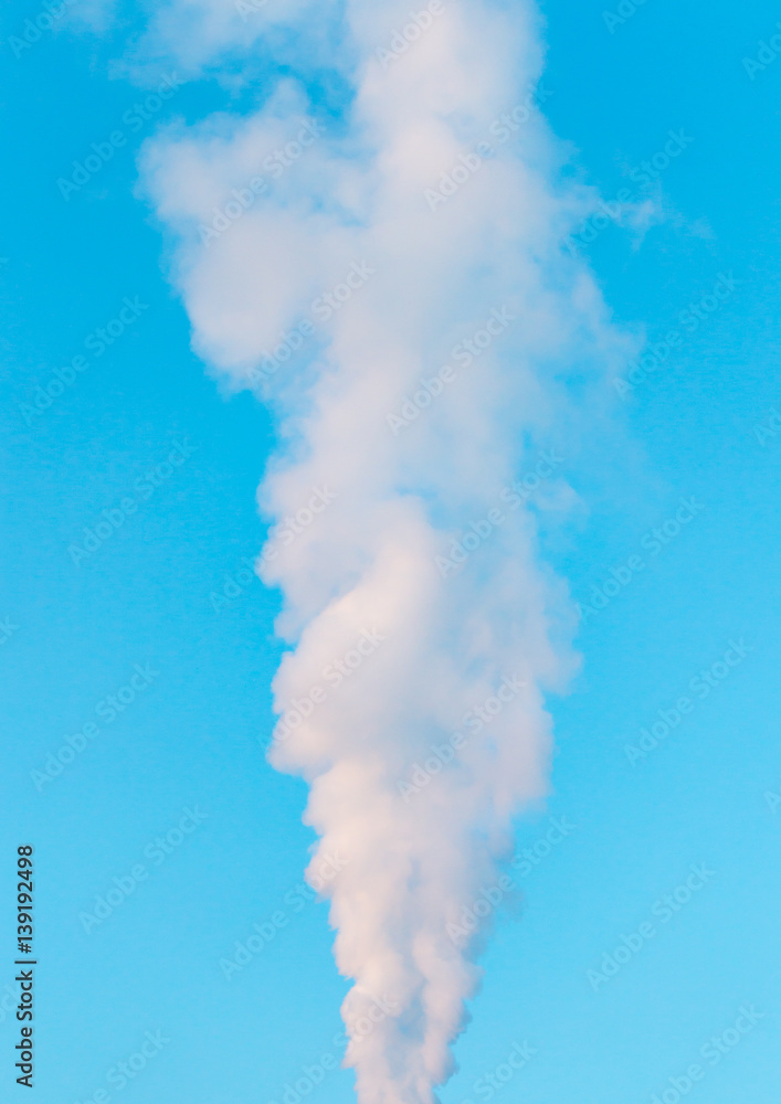 white industrial smoke from the chimney on a blue sky white industrial smoke from the chimney on a blue sky