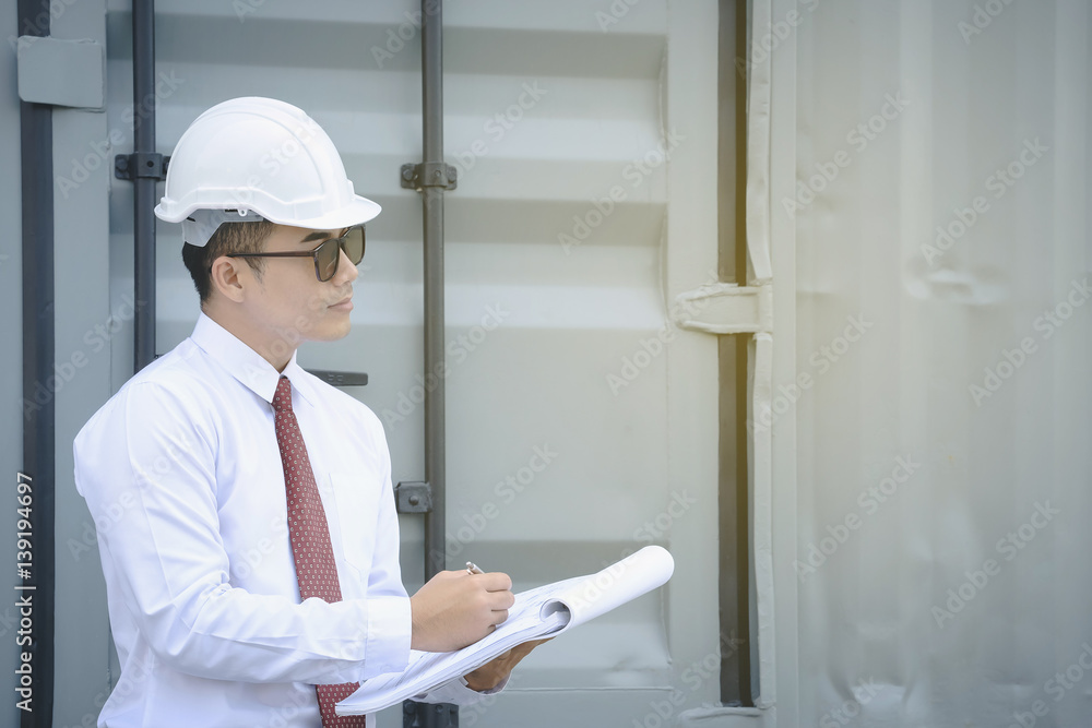 Young engineer wearing a white hat, red tie inspector holds thumb is happy with the work. Young engineer wearing a white hat, red tie inspector holds thumb is happy with the work.