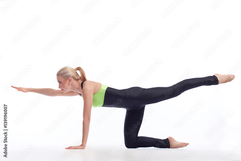 Attractive female gymnast exercising at studio Attractive female gymnast exercising at studio