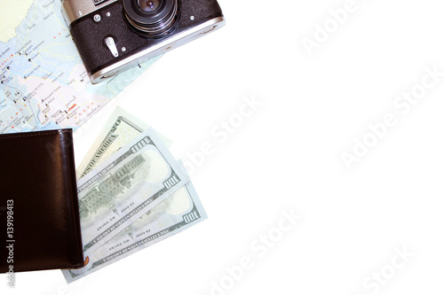 Camera, dollars, passport, and map on a white background. The concept of travel. top view 