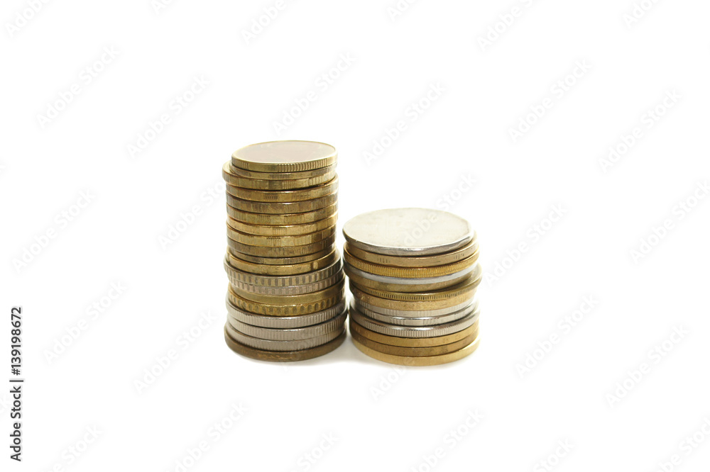 Two stacks of coins of different size isolated on white background Two stacks of coins of different size isolated on white background