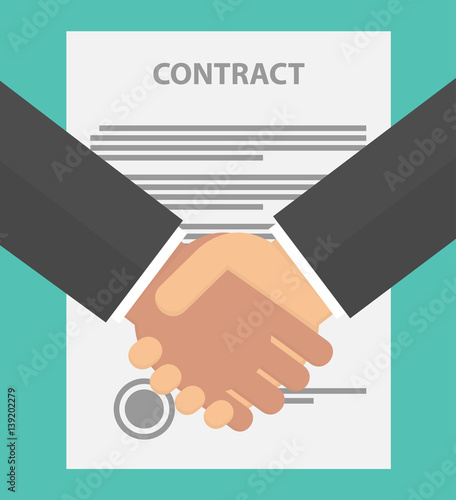 Handshake with a contract in the background