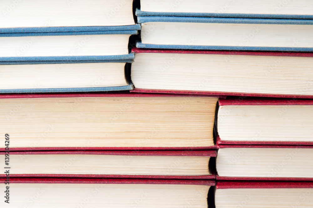 pile of books stacked on top of each other pile of books stacked on top of each other