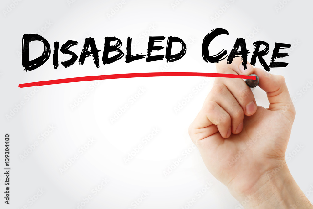Hand writing disabled care with marker, concept background Hand writing disabled care with marker, concept background