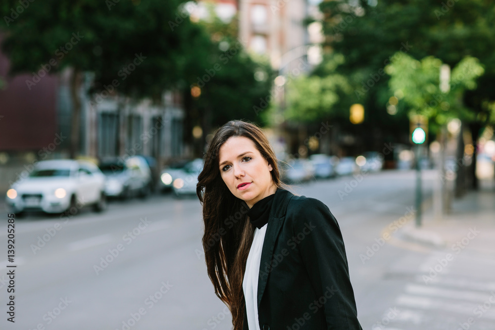 Fototapeta premium Woman waiting on crossroad