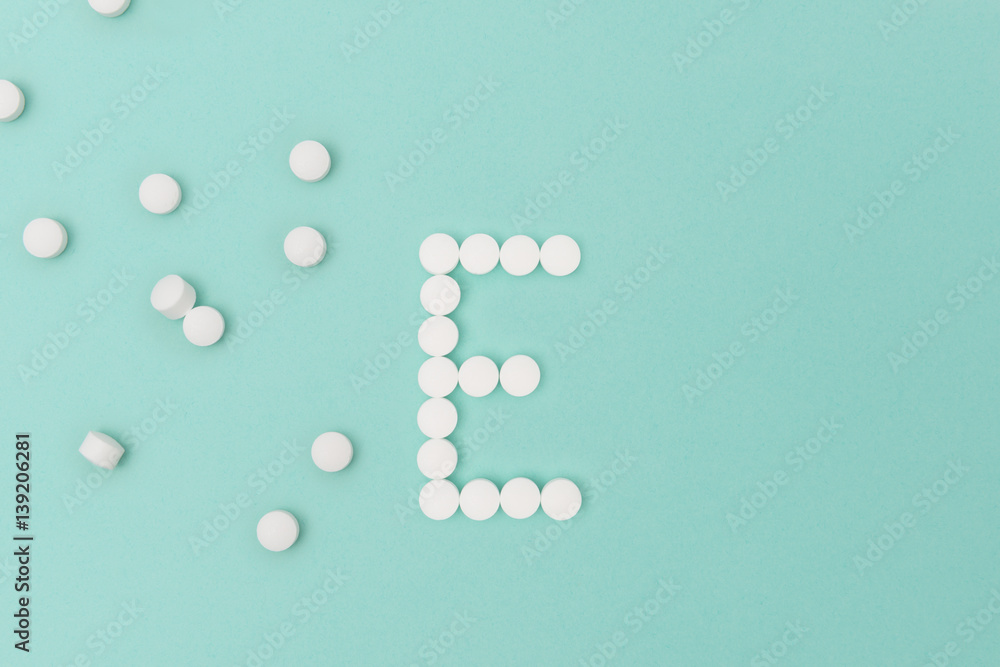 Vitamin E Pills Forming the Letter 'E'