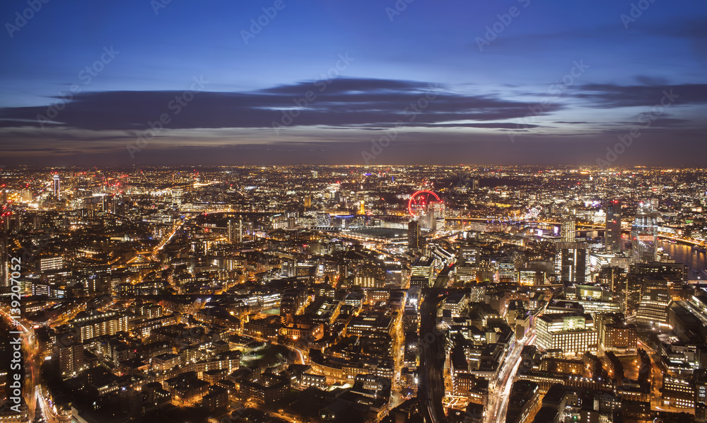 aerial view of London city in United Kingdom. Night scene photo with long exposure