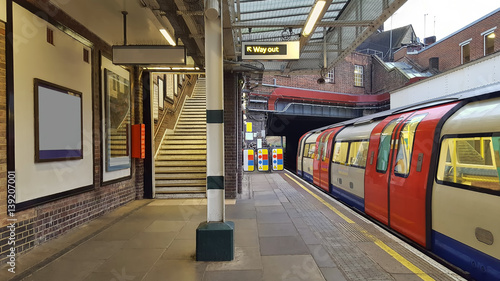 Photography traditional underground station and train in motion