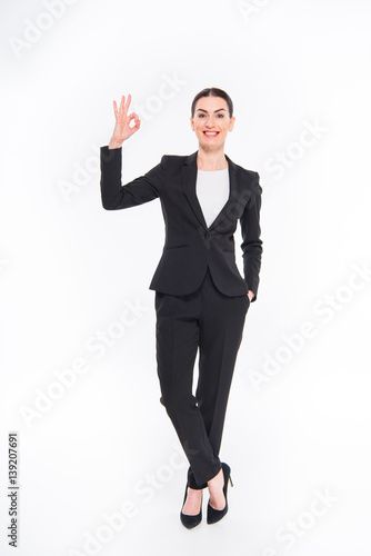 Businesswoman showing OK sign