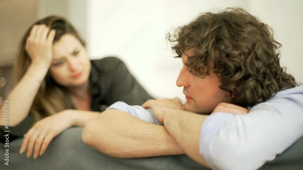 Woman trying to speak to her boyfriend but he looks offended
