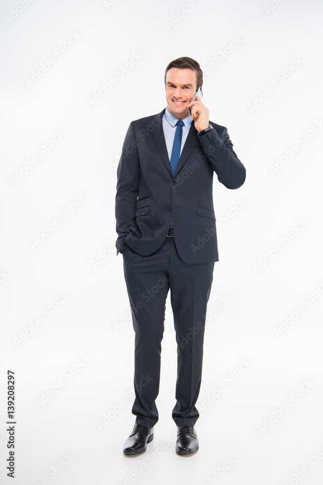 Businessman talking on smartphone Businessman talking on smartphone