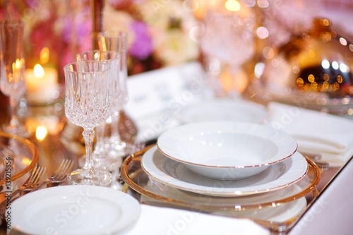 Beautiful table setting with crockery and flowers for a party, wedding reception or other festive event